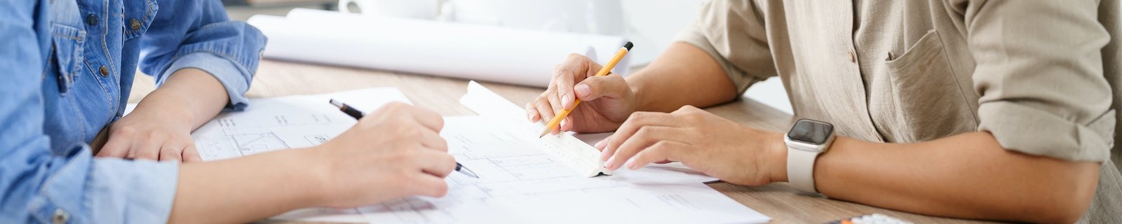 Engineering construction concept, Two female engineers is brainstorming sketches blueprint together