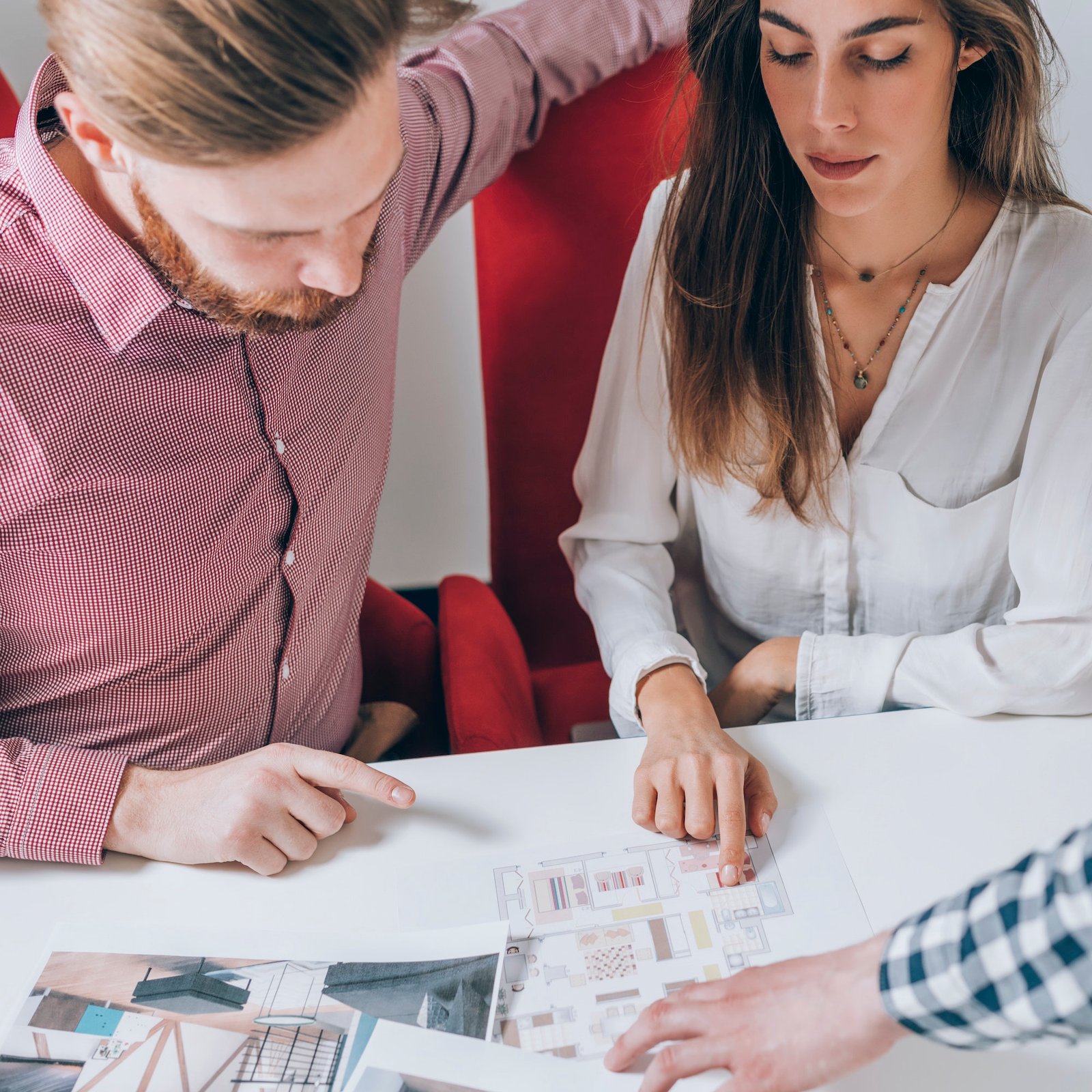 Real Estate Agency. Couple Looking at a Model of Their New Home